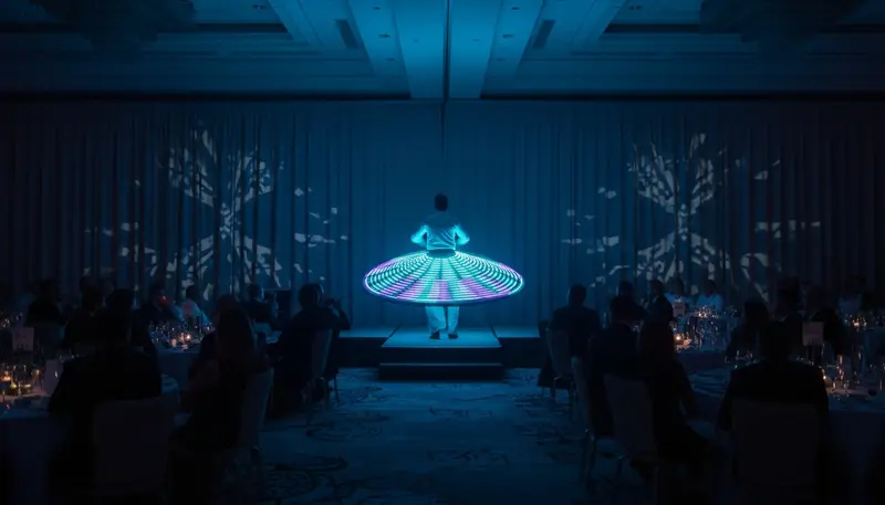 LED tanoura dancer spinning a glowing skirt on stage at a corporate gala dinner in a Dubai hotel ballroom